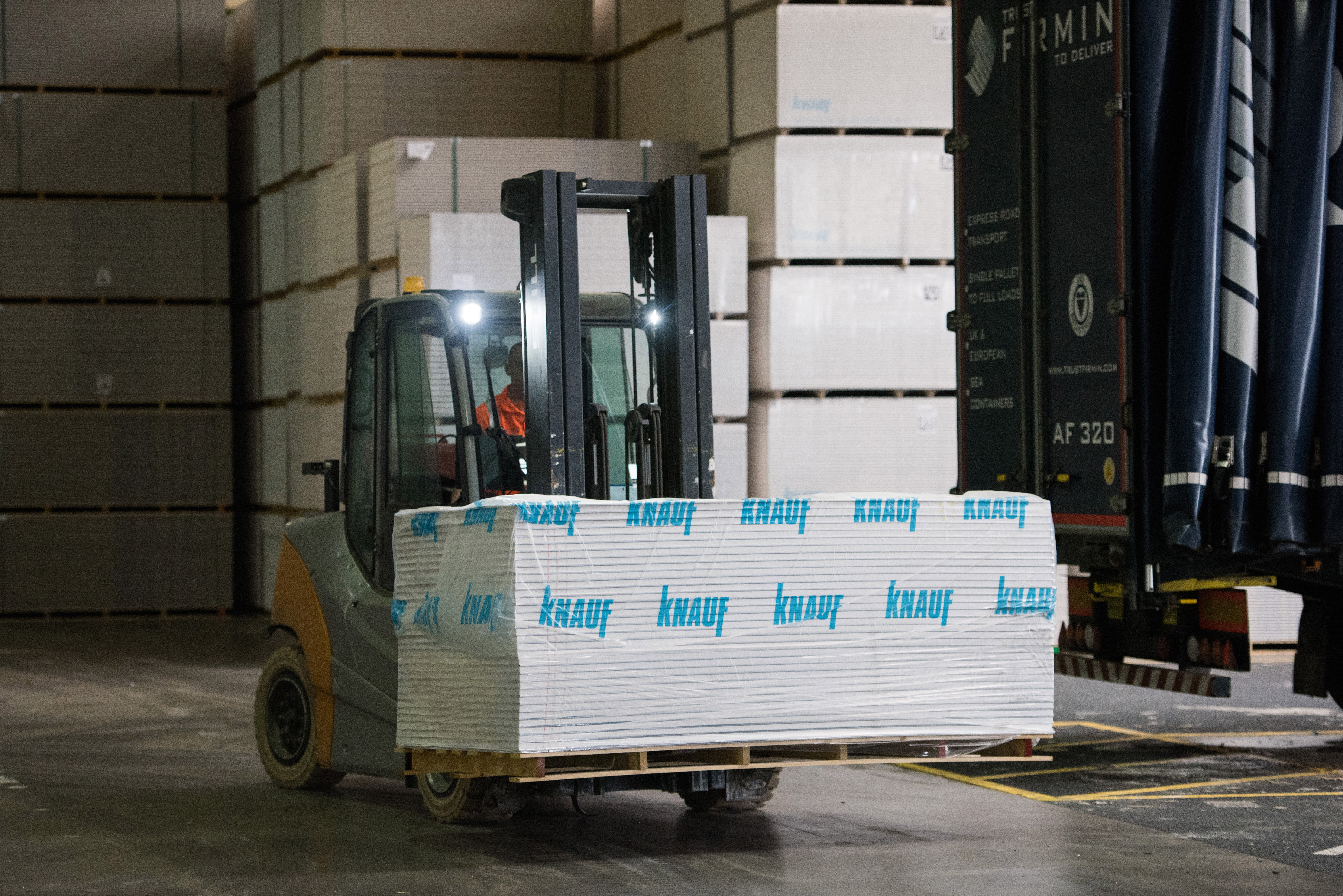 Forklift carrying Knauf boxes